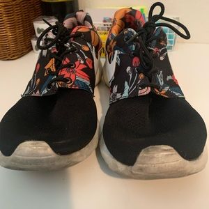 Black and floral Nike running shoes